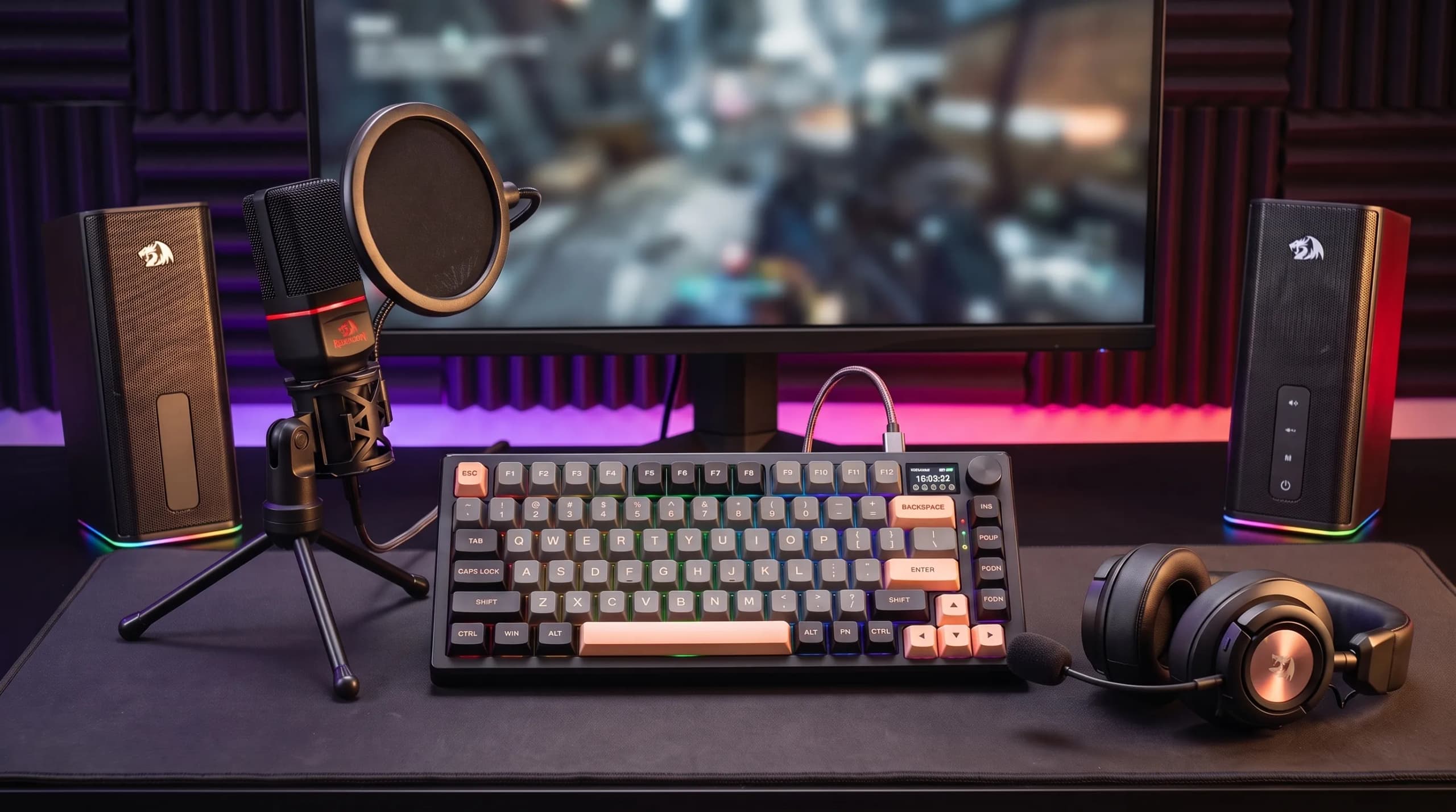 A streamer's desk with Redragon devices: microphone, headset, keyboard